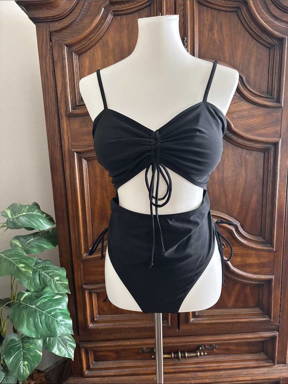 Black one piece swimsuit with tie detail drawstring